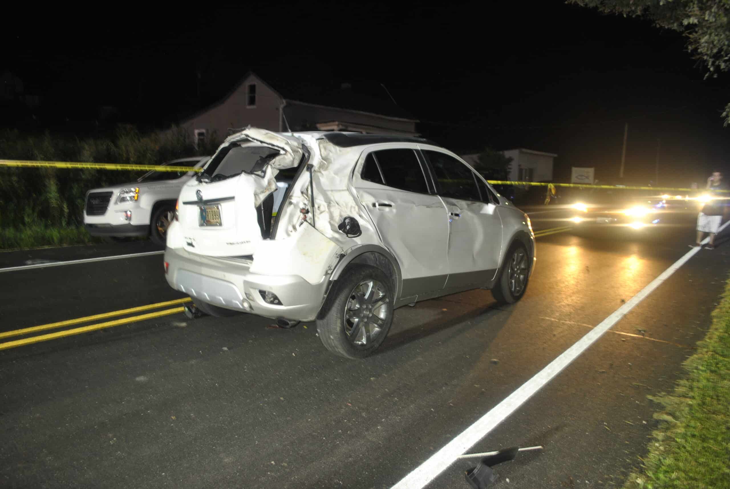 An automobile accident on an Indiana road at night.