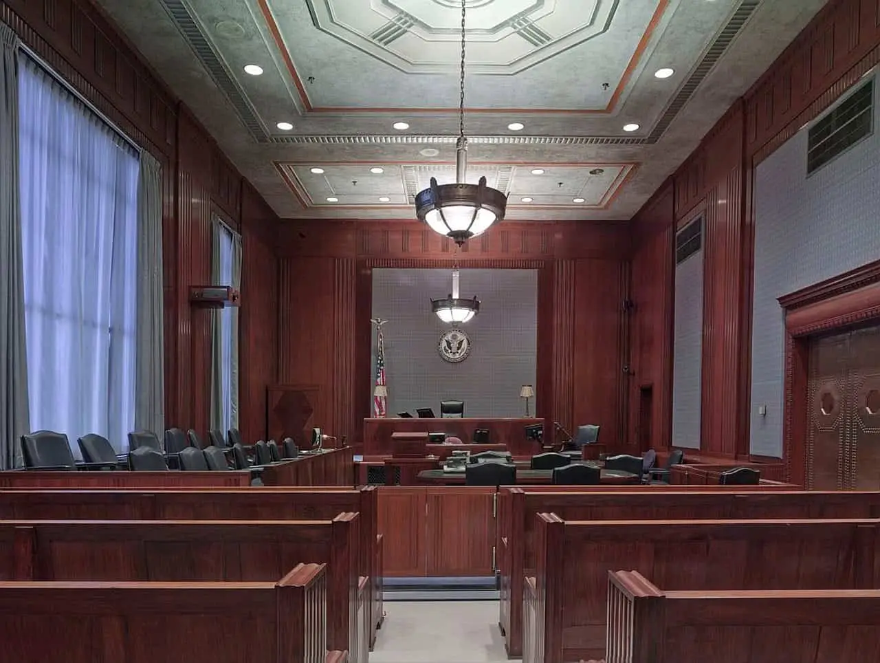 The inside of an empty courtroom, where jury trials take place.