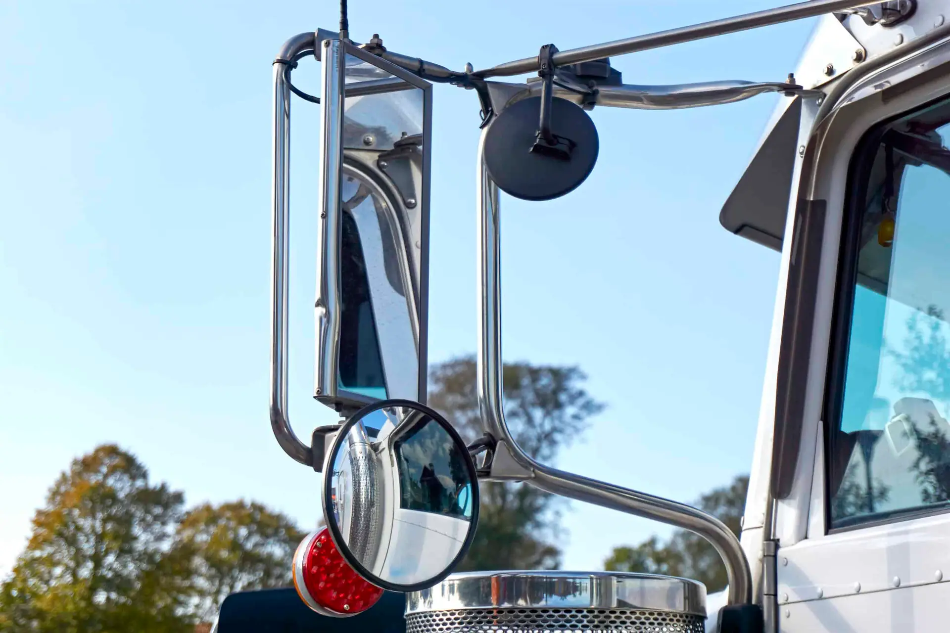 the side-view mirrors of a large tractor-trailer. 