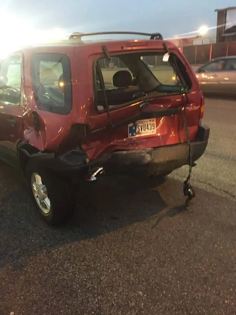 The damaged rear end of an Indiana vehicle after a car accident.