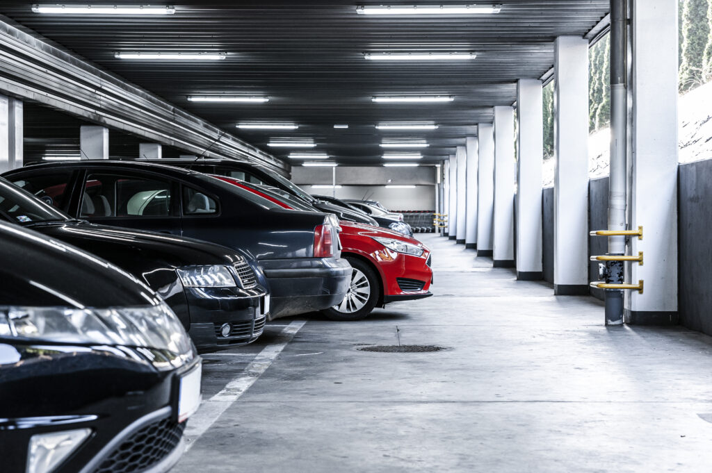 A parking garage filled with rental vehicles.