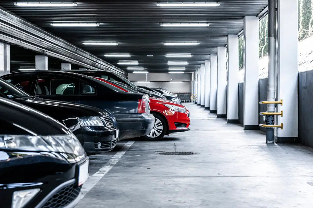 A parking garage filled with rental vehicles.