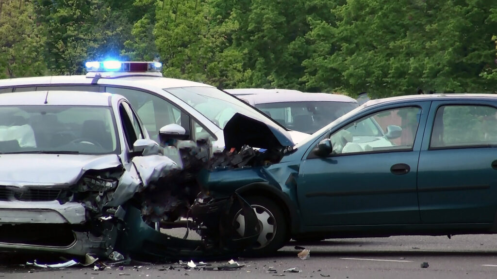 A police vehicle on the scene of a multi-car accident.
